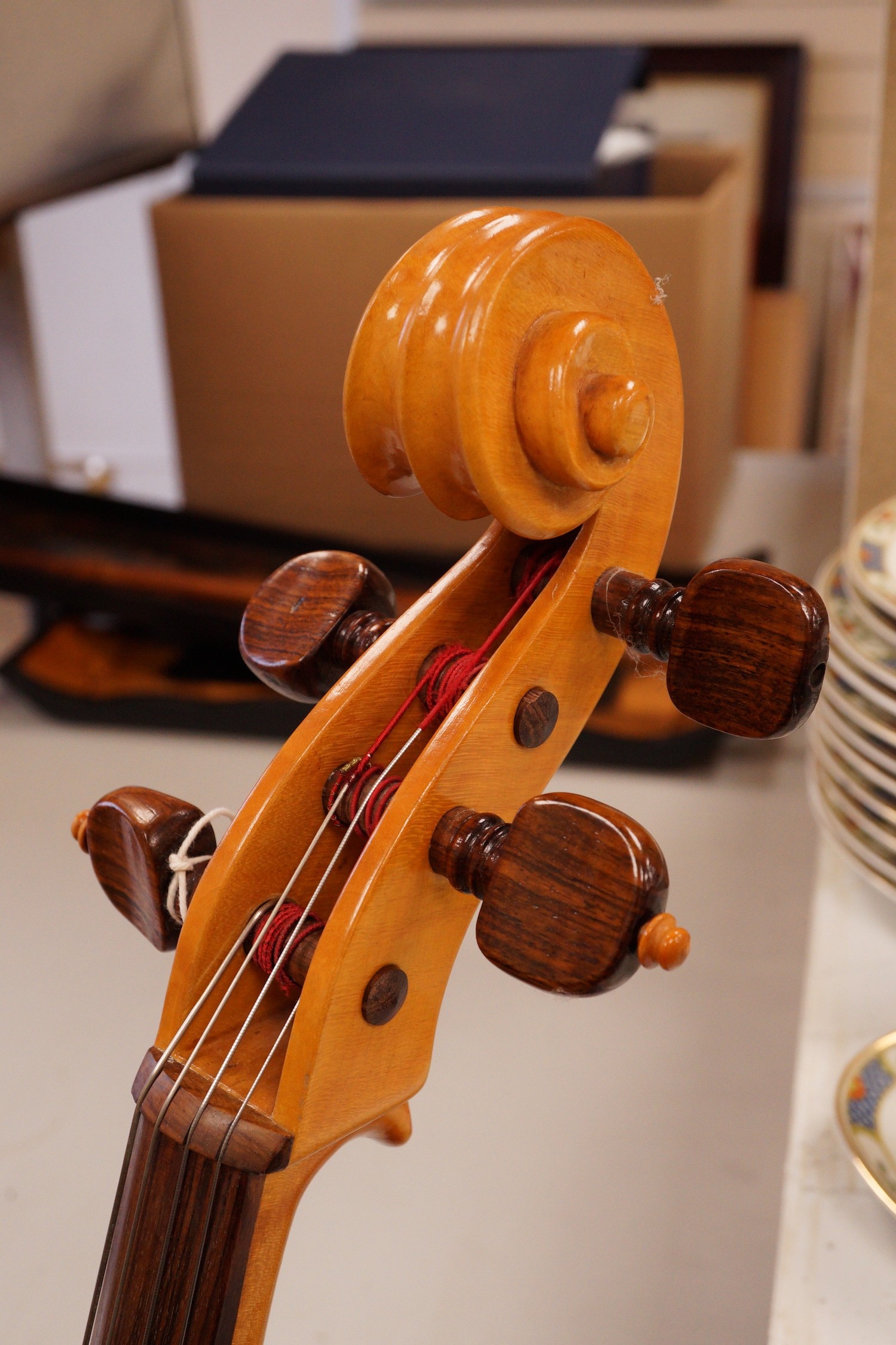 A cello and bow, back measures 73cm